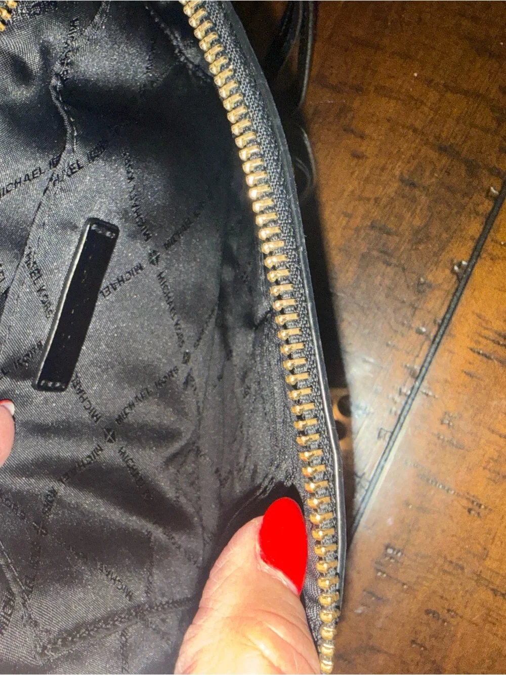 Michael Kors Black Embossed MK Zip Pouch with Gold Logo